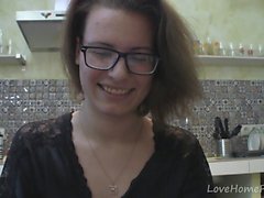 Solo girl with glasses chatting in the kitchen