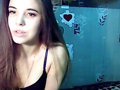 Sexy little brunette is on her live webcam chatting and sho