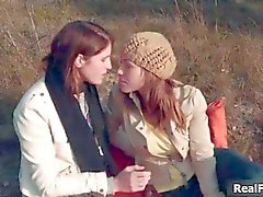 Sexy lesbian friends having a picnic