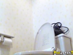 Asian rubs pee soaked vag