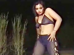 Muslim Paki Mujra Dancer gyrating in transparent Black Shalwar to Music