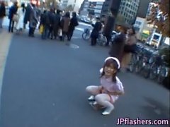 Naughty Asian girl is pissing in public