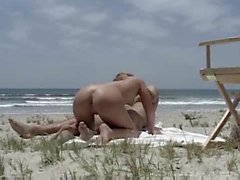 Having sex on the beach with people watching