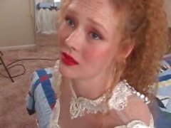 Redhead in wedding dress models her pussy