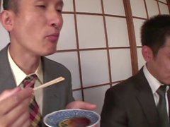 Business men eat sushi out of a naked girl&039s body