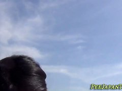 Asian skank peeing in public