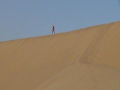 man naked on huge dunes