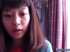 Asian teen drinks piss