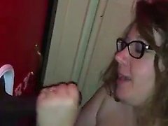 Fat wife sucking dick in the gloryhole