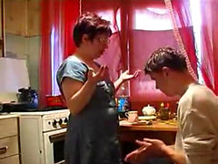 Mom teaches nerd son to fuck in the kitchen