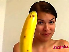 European amateur brunette fucks pussy with banana